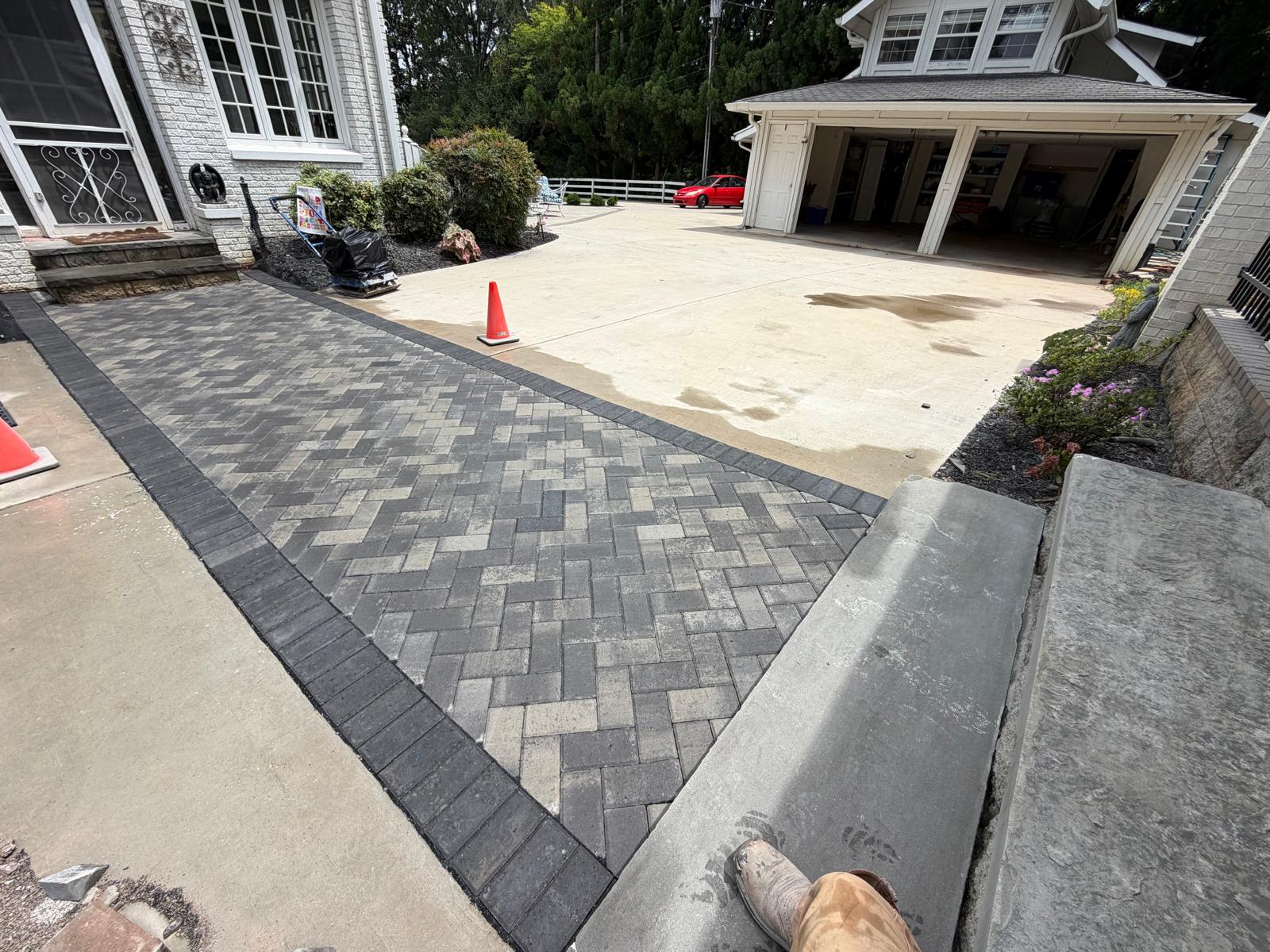 Paver courtyard apron blending into the driveway