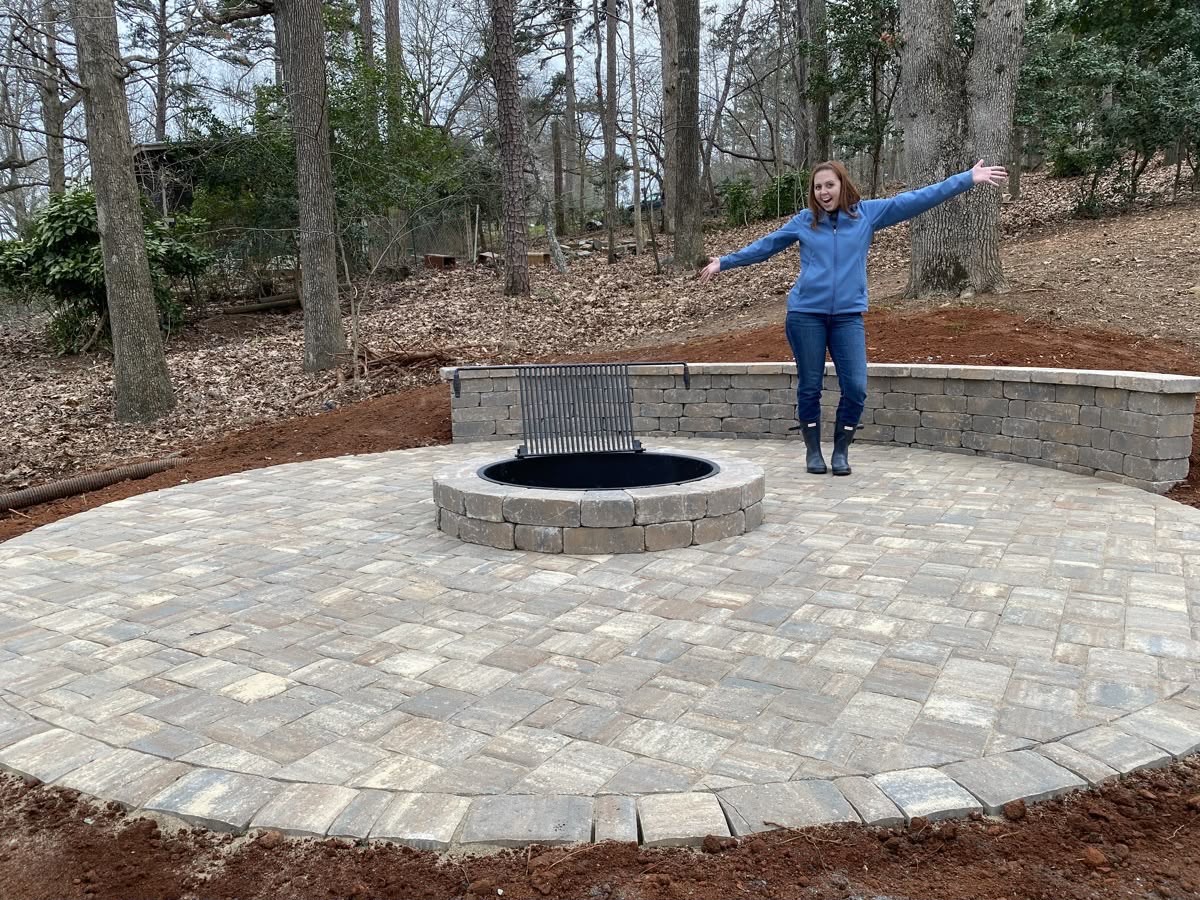 Round paver patio with wood-burning fire pit