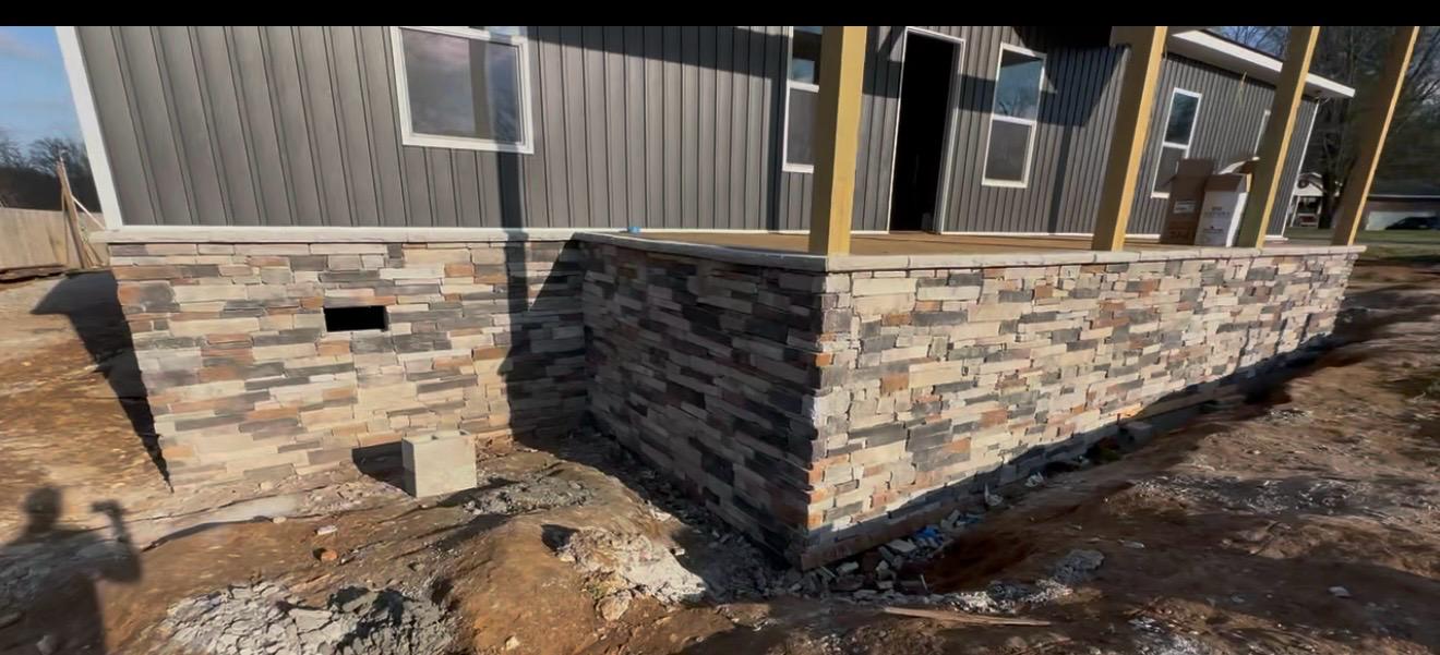 Stone veneer porch foundation