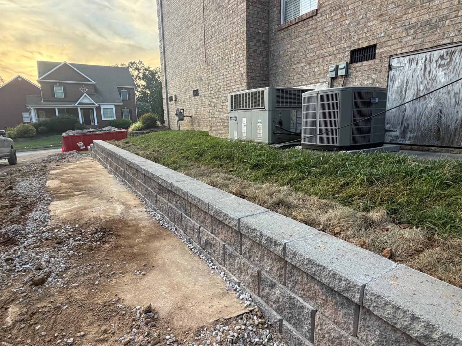 Granite-blend block wall along a new driveway