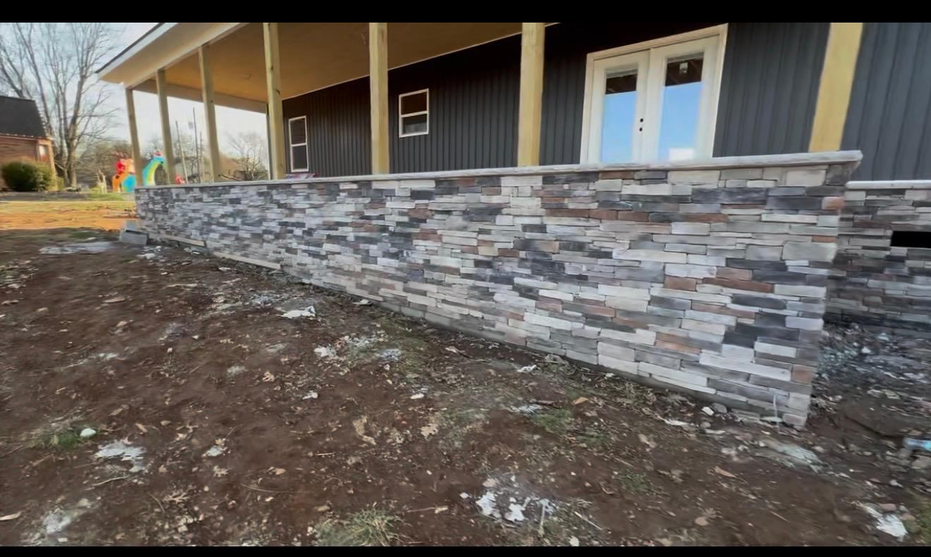 Stacked stone veneer wall